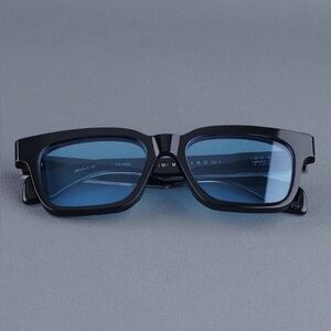 Jacques Marie Mage Black Sunglasses 
Molino Model bel air blue lenses